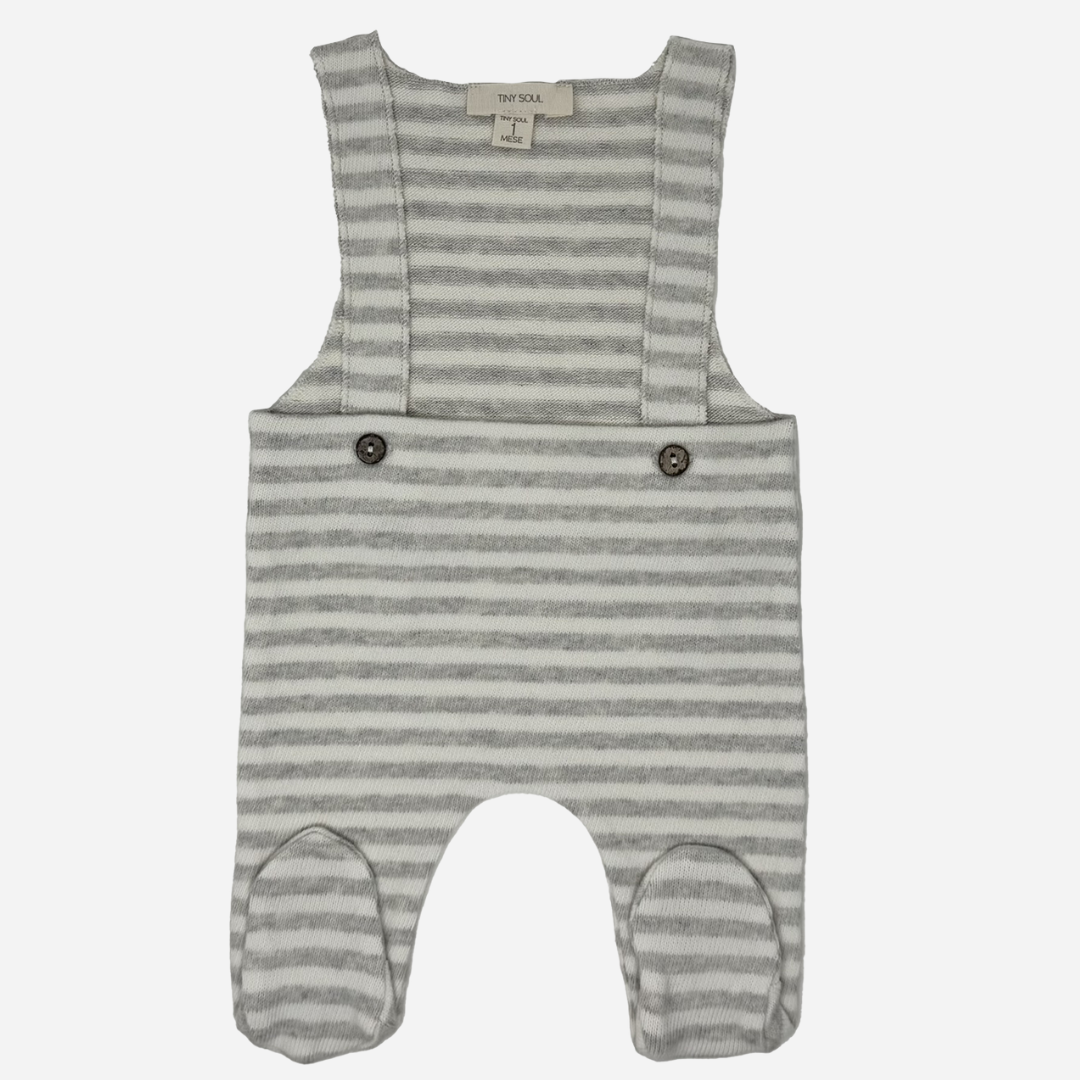 Sold at Bombon shop, designed by Tiny Soul — baby footed overall in grey and white stripes with buttoned shoulder straps and attached feet. front