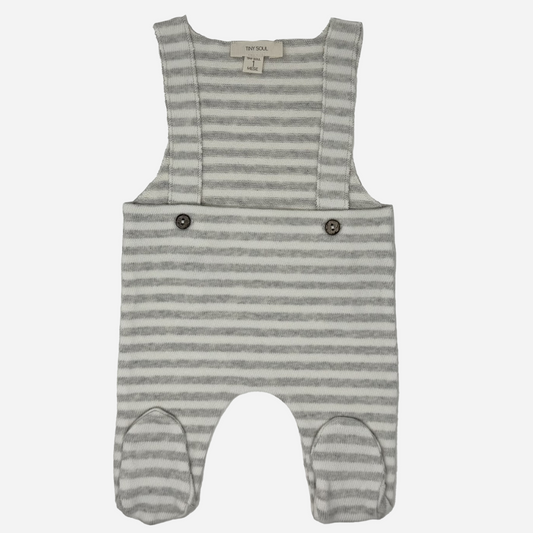 Sold at Bombon shop, designed by Tiny Soul — baby footed overall in grey and white stripes with buttoned shoulder straps and attached feet. front