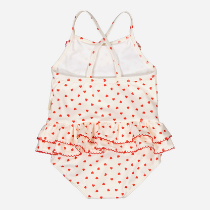 Sold at Bombon shop, designed by Mar Mar Copenhagen brand, this cute bathing suit in a small red heart print for baby girls and toddlers is perfect for spring and summer. back view