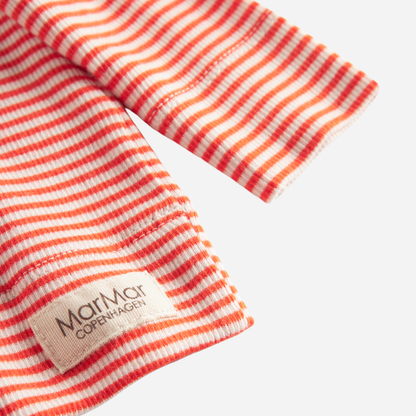 Sold at Bombon shop, designed by MarMar Copenhagen. Coral and cream striped baby cardigan with snap buttons, pairs perfectly with the matching coral striped footed pants.