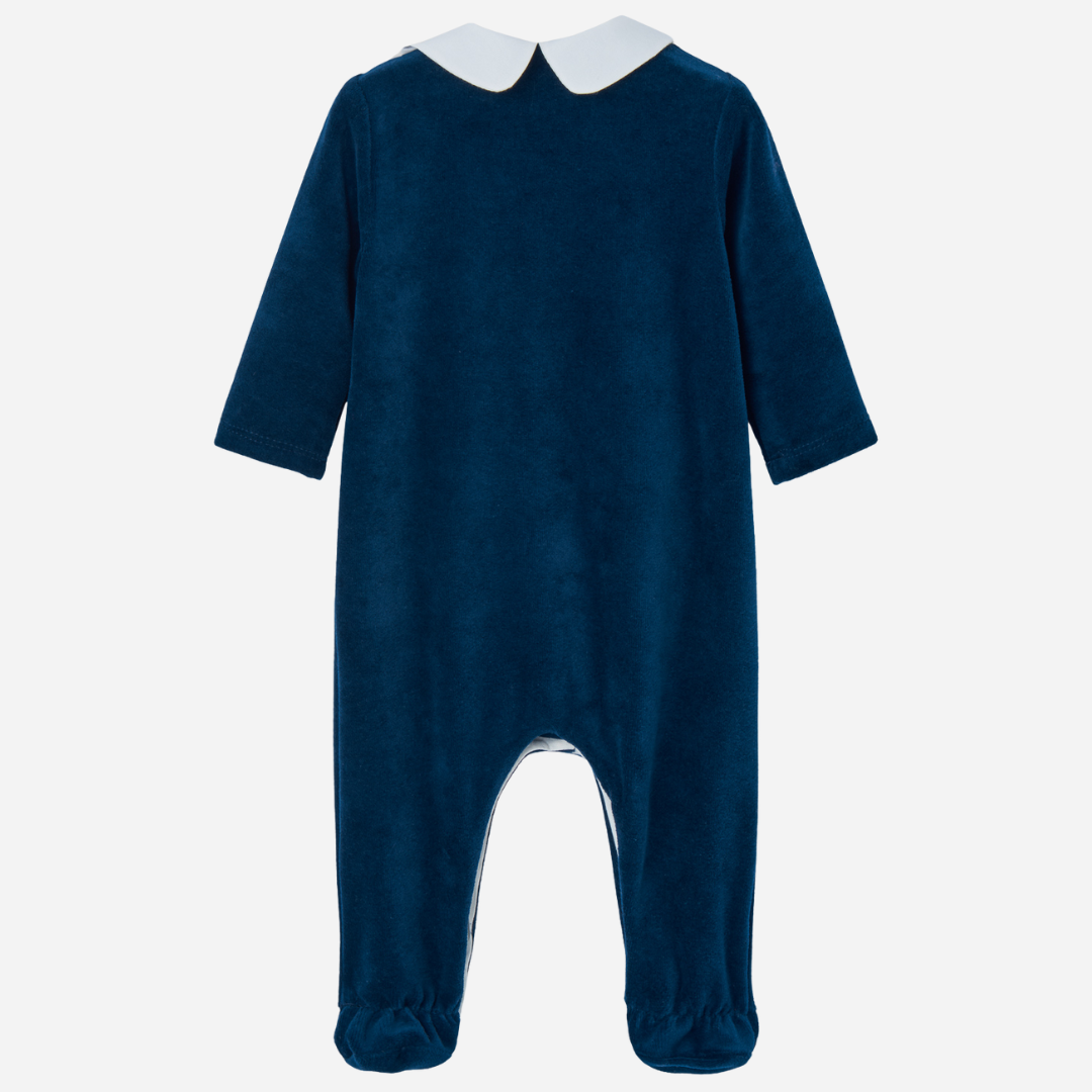 Sold at Bombon shop, designed by Paz Rodriguez, navy velour baby jumpsuit with white collar and embroidered front panel