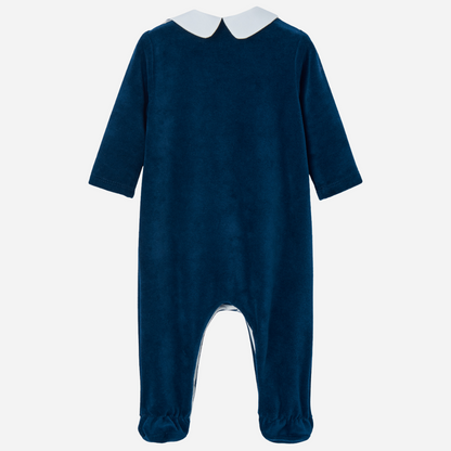 Sold at Bombon shop, designed by Paz Rodriguez, navy velour baby jumpsuit with white collar and embroidered front panel