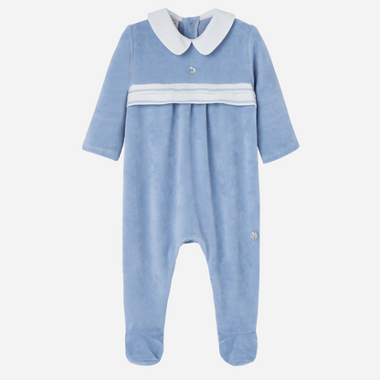 Sold at Bombon shop, designed by Paz Rodriguez. Baby boy footed velour jumpsuit in sky blue with white Peter Pan collar and embroidered chest detail.