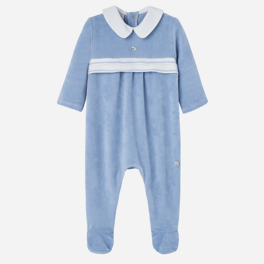 Sold at Bombon shop, designed by Paz Rodriguez. Baby boy footed velour jumpsuit in sky blue with white Peter Pan collar and embroidered chest detail.