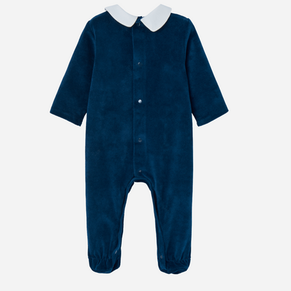 Sold at Bombon shop, designed by Paz Rodriguez, navy velour baby girl jumpsuit with cherry embroidery on white collar and red velvet trim.