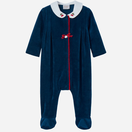 Sold at Bombon shop, designed by Paz Rodriguez, navy velour baby girl jumpsuit with cherry embroidery on white collar and red velvet trim.