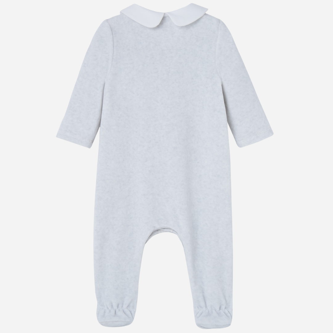 Sold at Bombon shop, designed by Paz Rodriguez. Light grey velour baby jumpsuit with white collar, lace detailing, and front button closure.