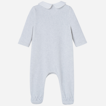 Sold at Bombon shop, designed by Paz Rodriguez. Light grey velour baby jumpsuit with white collar, lace detailing, and front button closure.