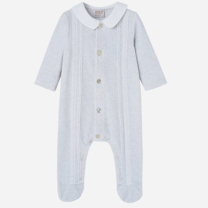 Sold at Bombon shop, designed by Paz Rodriguez. Light grey velour baby jumpsuit with white collar, lace detailing, and front button closure.
