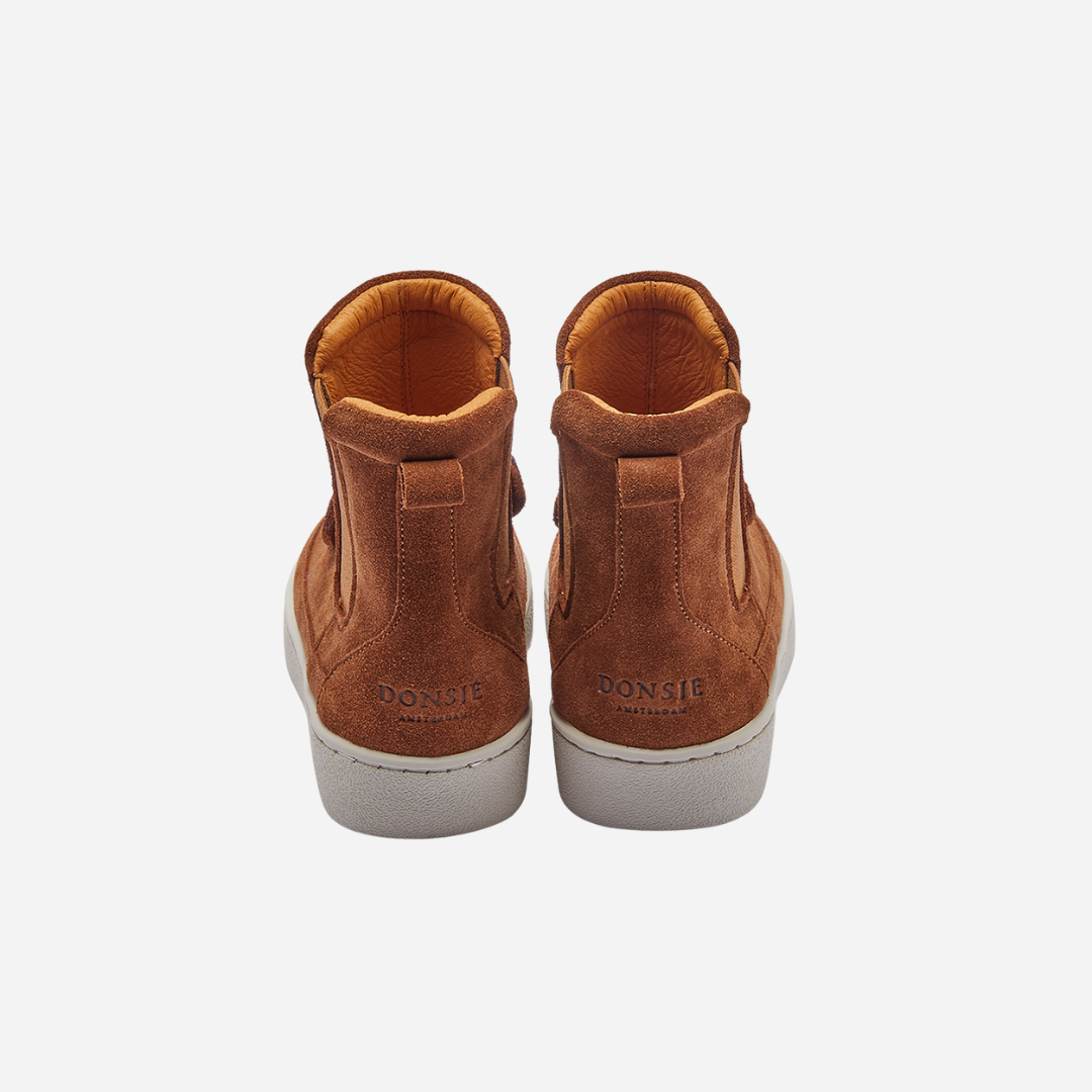 Sold at Bombon shop, designed by Donsje from Amsterdam, these cognac suede bear boots are perfect to keep little toes warm and looking cute! back view