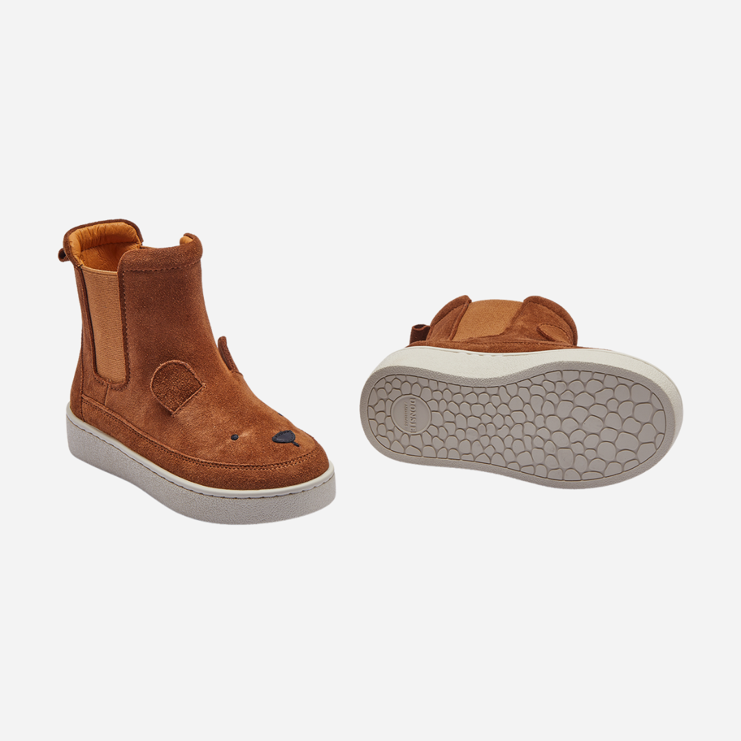 Sold at Bombon shop, designed by Donsje from Amsterdam, these cognac suede bear boots are perfect to keep little toes warm and looking cute! bottom view