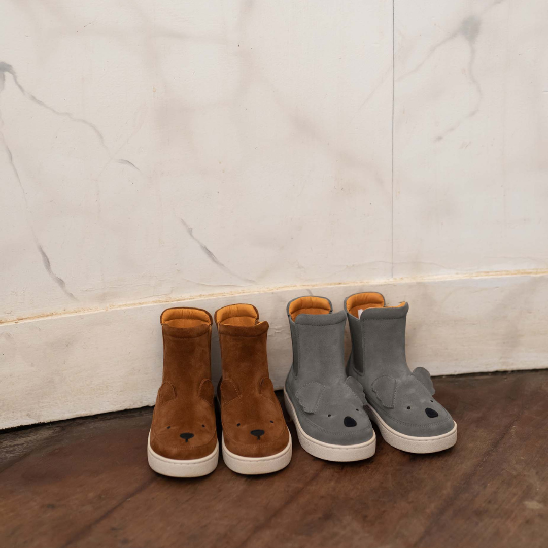 Sold at Bombon shop, designed by Donsje from Amsterdam, these cognac suede bear boots are perfect to keep little toes warm and looking cute! lifestyle view