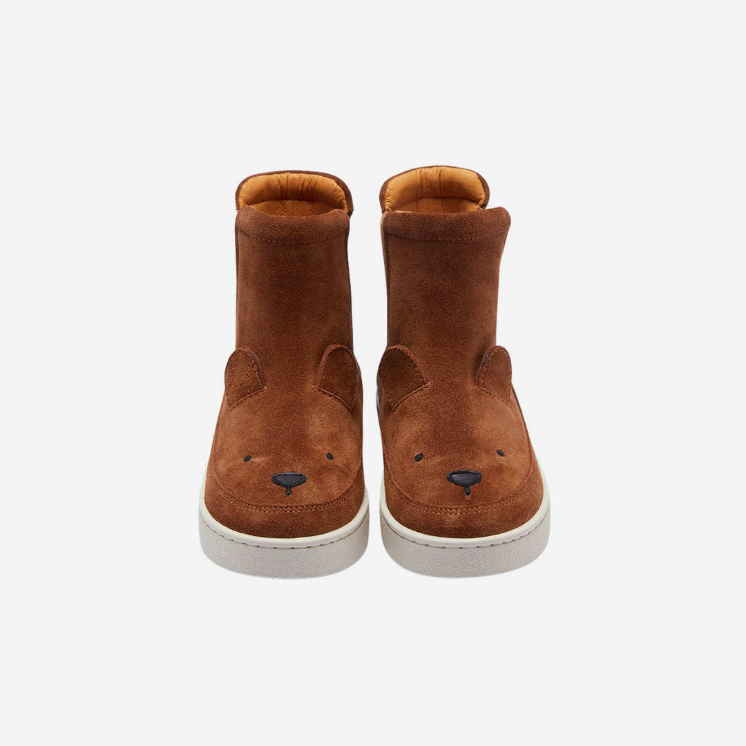 Sold at Bombon shop, designed by Donsje from Amsterdam, these cognac suede bear boots are perfect to keep little toes warm and looking cute! front view