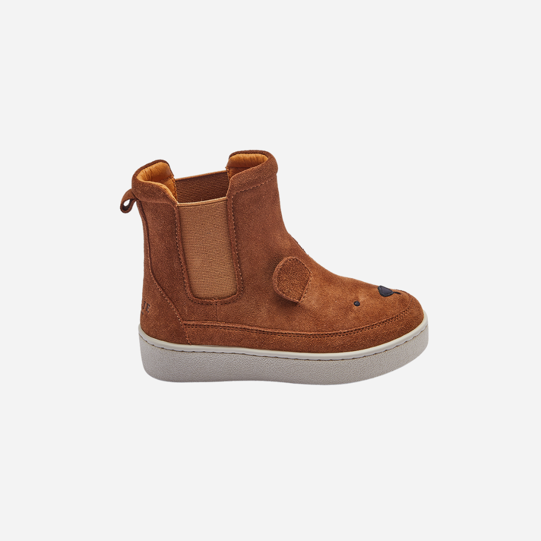 Sold at Bombon shop, designed by Donsje from Amsterdam, these cognac suede bear boots are perfect to keep little toes warm and looking cute! side view