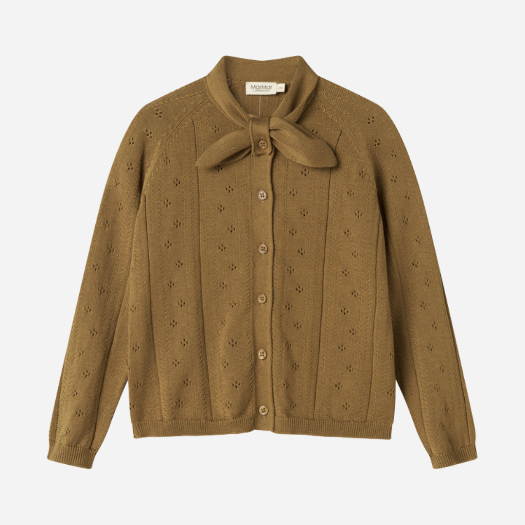 Sold at Bombon shop, designed by MarMar Copenhagen — golden brown cotton knit baby cardigan with bow tie collar and pointelle details, pairs perfectly with the floral skirt.