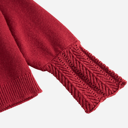 Sold at Bombon shop, designed by MarMar Copenhagen. Deep red knit baby cardigan with scalloped cuffs, pairs perfectly with the red plaid bloomers and embroidered collar bodysuit.