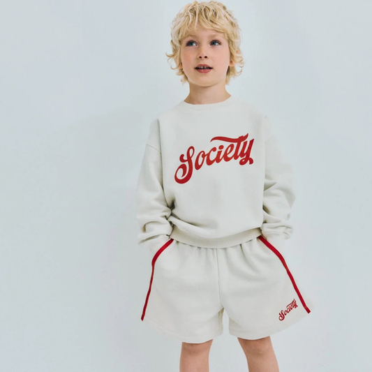 sold at Bombon, designed by The New Society ecru kids bermuda shorts in 100% cotton with elastic waist relaxed fit pairs with tilo sweatshirt