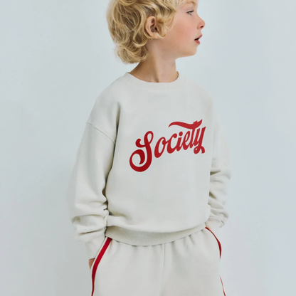 sold at Bombon, designed by The New Society ecru kids bermuda shorts in 100% cotton with elastic waist relaxed fit pairs with tilo sweatshirt