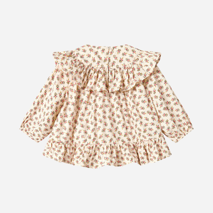 Sold at Bombon shop, designed by MarMar Copenhagen — floral cotton baby blouse with ruffled collar and hem, pairs perfectly with matching floral bloomers.