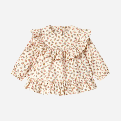 Sold at Bombon shop, designed by MarMar Copenhagen — floral cotton baby blouse with ruffled collar and hem, pairs perfectly with matching floral bloomers.