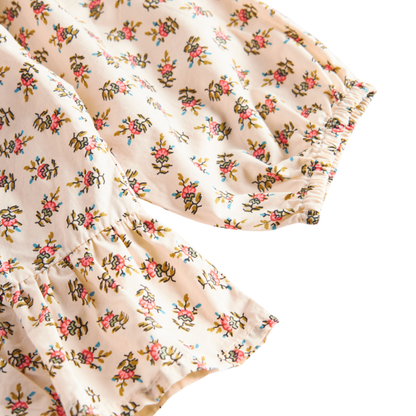Sold at Bombon shop, designed by MarMar Copenhagen — floral cotton baby blouse with ruffled collar and hem, pairs perfectly with matching floral bloomers.