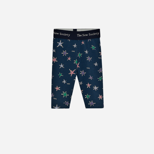 Sold at Bombon shop, these baby girl leggings by The New Society come in a navy jersey fabric with a vibrant star print and a soft elastic logo waistband for a comfy and secure fit. front