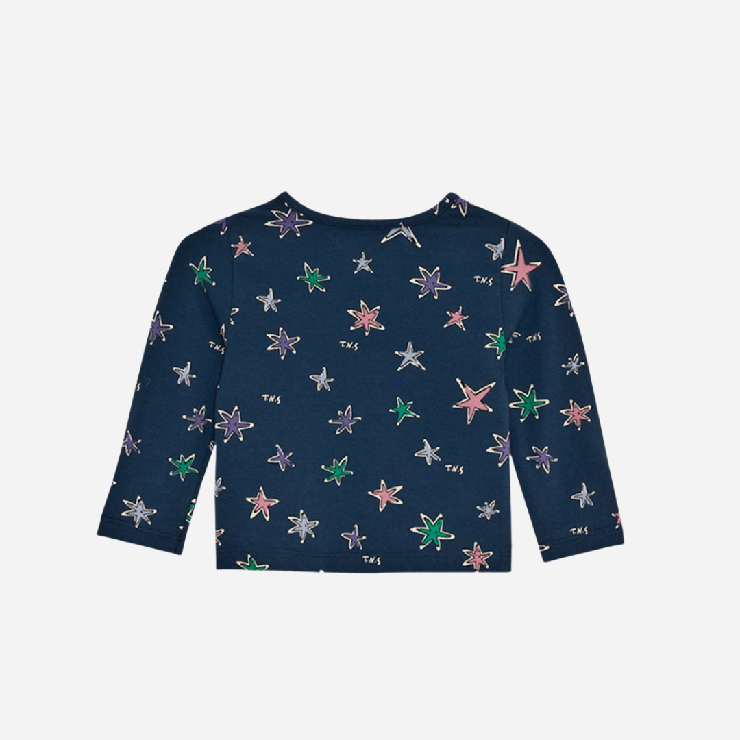 Sold at Bombon shop, this baby girl tee by The New Society features a navy base with an all-over colorful star print, long sleeves, and a soft jersey fabric for everyday comfort with a playful twist. back