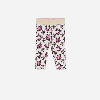 Sold at Bombon shop, designed by The New Society, these baby girl ribbed leggings feature a soft white base with an all-over rose floral print and a comfortable elastic waistband with logo detail. front