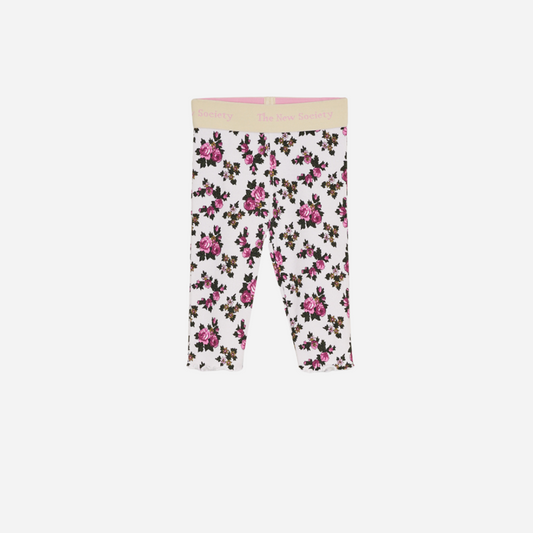 Sold at Bombon shop, designed by The New Society, these baby girl ribbed leggings feature a soft white base with an all-over rose floral print and a comfortable elastic waistband with logo detail. front
