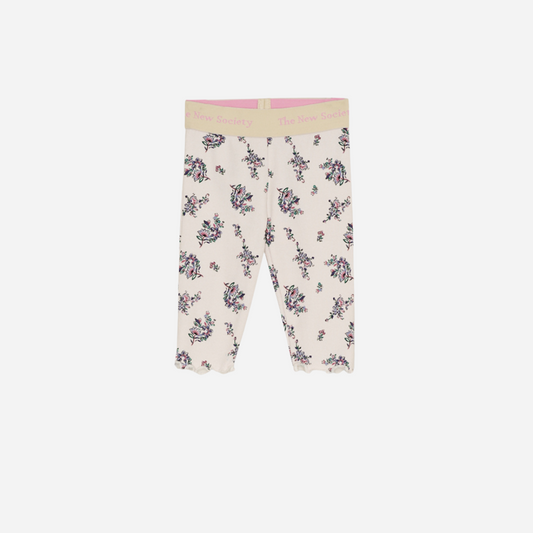 Sold at Bombon shop, these baby and toddler girl leggings by The New Society feature a soft cream base with an all-over floral print, a comfortable elastic waistband with logo detail, and a delicate lettuce-edge hem for a sweet everyday essential. front