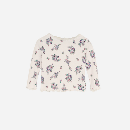 Sold at Bombon shop, this baby and toddler girl ribbed top by The New Society is adorned with a charming floral print and finished with a scalloped neckline and hem—perfect for layering or wearing on its own with matching bottoms. front