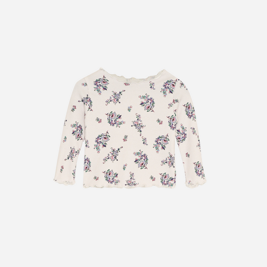 Sold at Bombon shop, this baby and toddler girl ribbed top by The New Society is adorned with a charming floral print and finished with a scalloped neckline and hem—perfect for layering or wearing on its own with matching bottoms. front