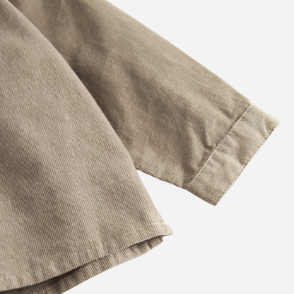 Sold at Bombon shop, designed by MarMar Copenhagen. Beige long-sleeve cotton shirt with mandarin collar, pairs perfectly with the matching check pants.