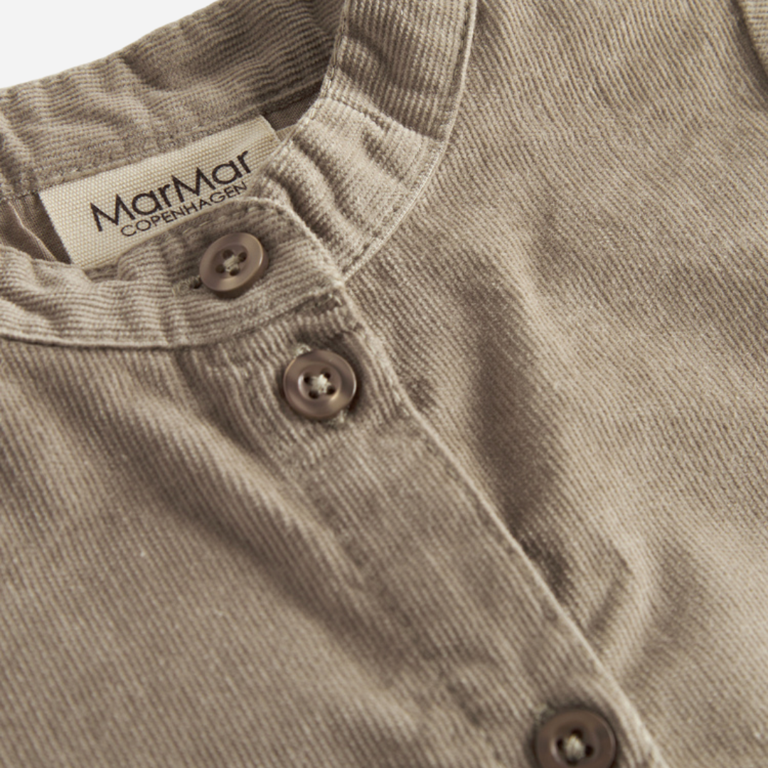 Sold at Bombon shop, designed by MarMar Copenhagen. Beige long-sleeve cotton shirt with mandarin collar, pairs perfectly with the matching check pants.