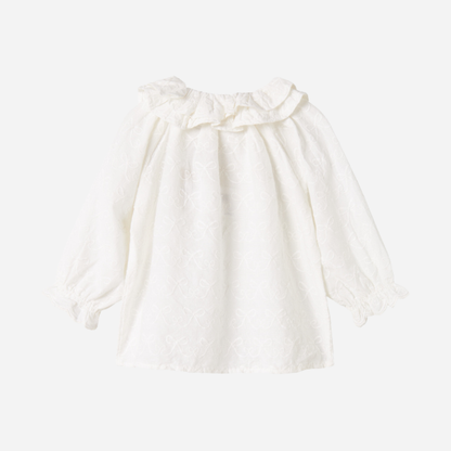 Sold at Bombon shop, designed by MarMar Copenhagen — cream 100% cotton baby blouse with ruffled collar and frilled cuff
