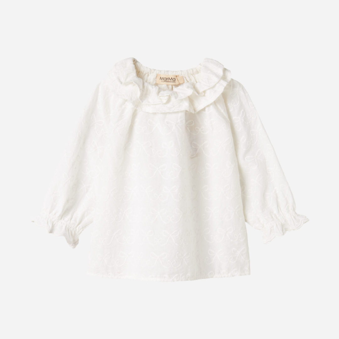 Sold at Bombon shop, designed by MarMar Copenhagen — cream 100% cotton baby blouse with ruffled collar and frilled cuff
