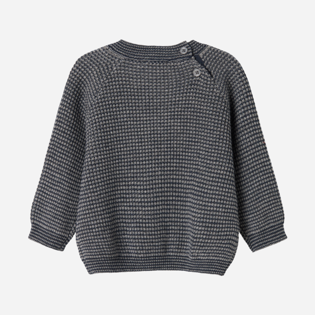 Sold at Bombon shop, designed by MarMar Copenhagen. Blue and beige textured knit baby sweater with shoulder buttons, pairs perfectly with the matching knit pants.