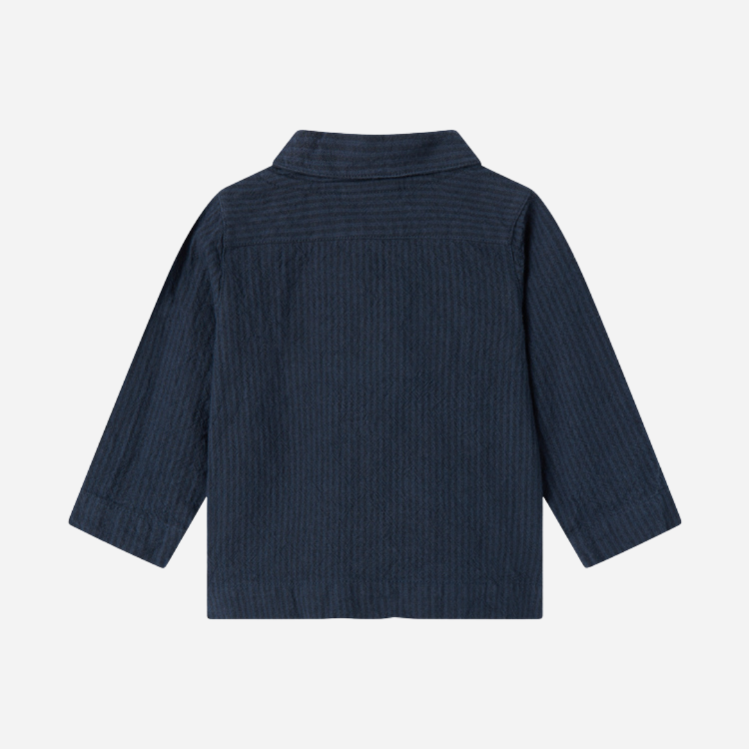 Sold at Bombon shop, designed by MarMar Copenhagen — navy 100% cotton textured long-sleeve baby shirt with buttons, part of a matching set