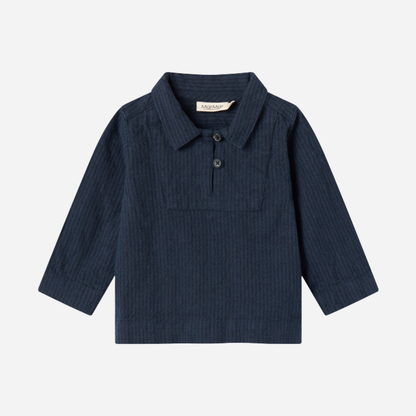 Sold at Bombon shop, designed by MarMar Copenhagen — navy 100% cotton textured long-sleeve baby shirt with buttons, part of a matching set