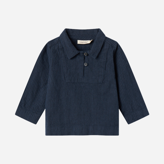 Sold at Bombon shop, designed by MarMar Copenhagen — navy 100% cotton textured long-sleeve baby shirt with buttons, part of a matching set