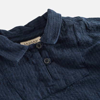 Sold at Bombon shop, designed by MarMar Copenhagen — navy 100% cotton textured long-sleeve baby shirt with buttons, part of a matching set