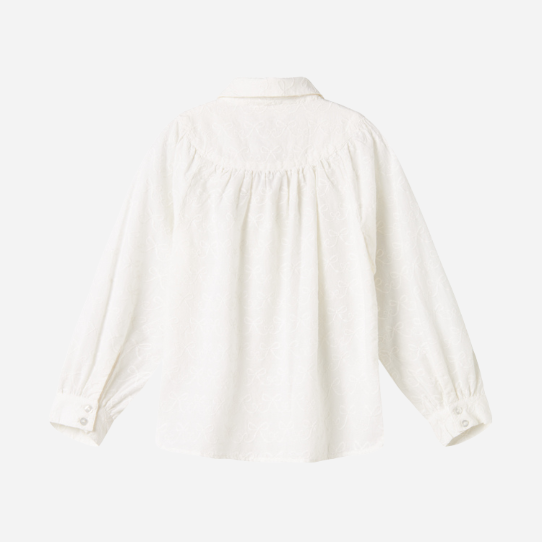Sold at Bombon shop, designed by MarMar Copenhagen — cream 100% cotton baby blouse with rounded collar and gathered details, pairs perfectly with the navy pinafore dress.