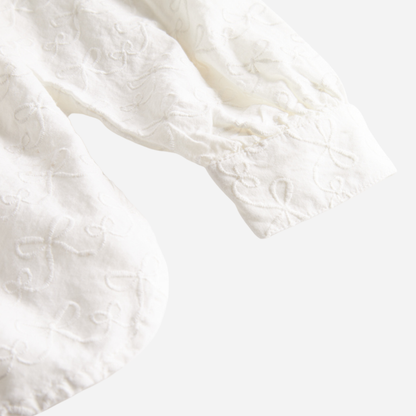 Sold at Bombon shop, designed by MarMar Copenhagen — cream 100% cotton baby blouse with rounded collar and gathered details, pairs perfectly with the navy pinafore dress.