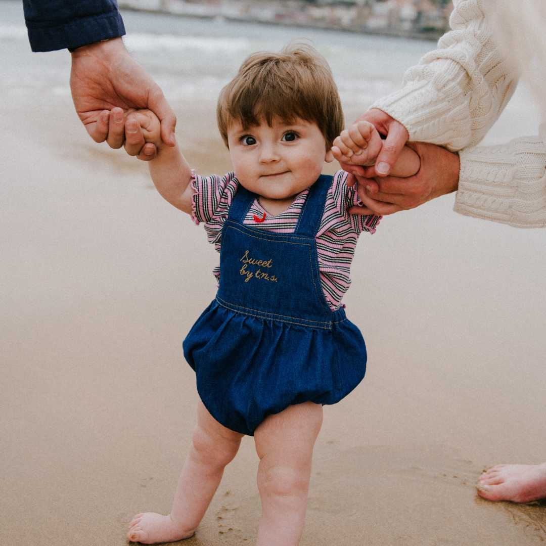 sold at Bombon, designed by The New Society blue denim baby romper in 100% cotton with classic silhouette and everyday wear style
