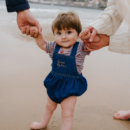 sold at Bombon, designed by The New Society blue denim baby romper in 100% cotton with classic silhouette and everyday wear style