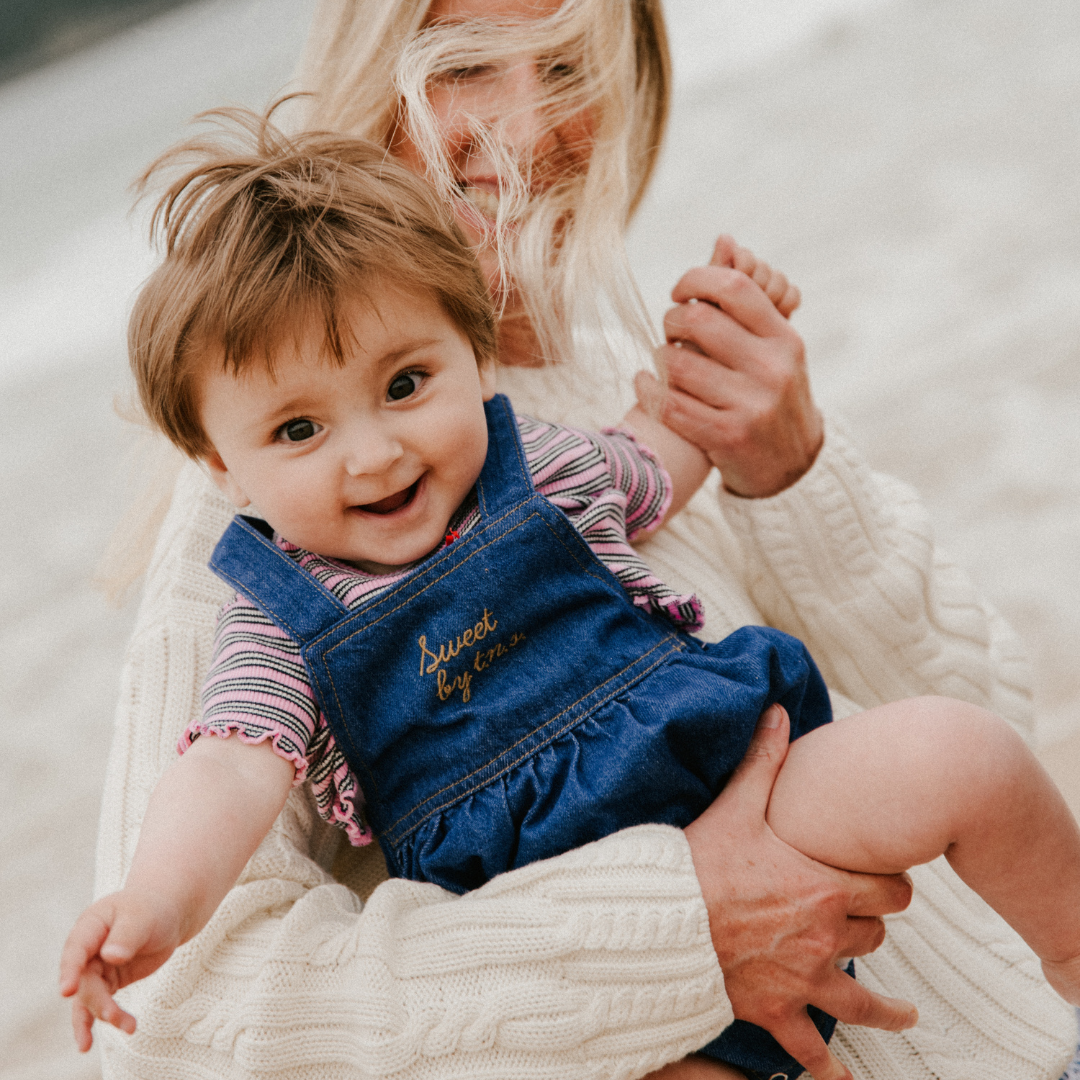 sold at Bombon, designed by The New Society blue denim baby romper in 100% cotton with classic silhouette and everyday wear style