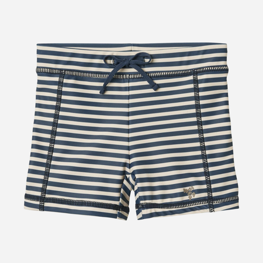 Sold at Bombon Shop, designed by Wheat, blue stripe swim shorts in recycled fabric with navy and light blue horizontal stripes and drawstring waistband.