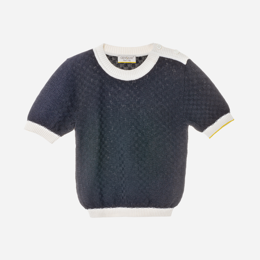Sold at Bombon and designed by Gensami, a navy blue short-sleeve knit baby sweater with white ribbed trim at the collar, sleeves, and hem, featuring a yellow accent on one cuff.
