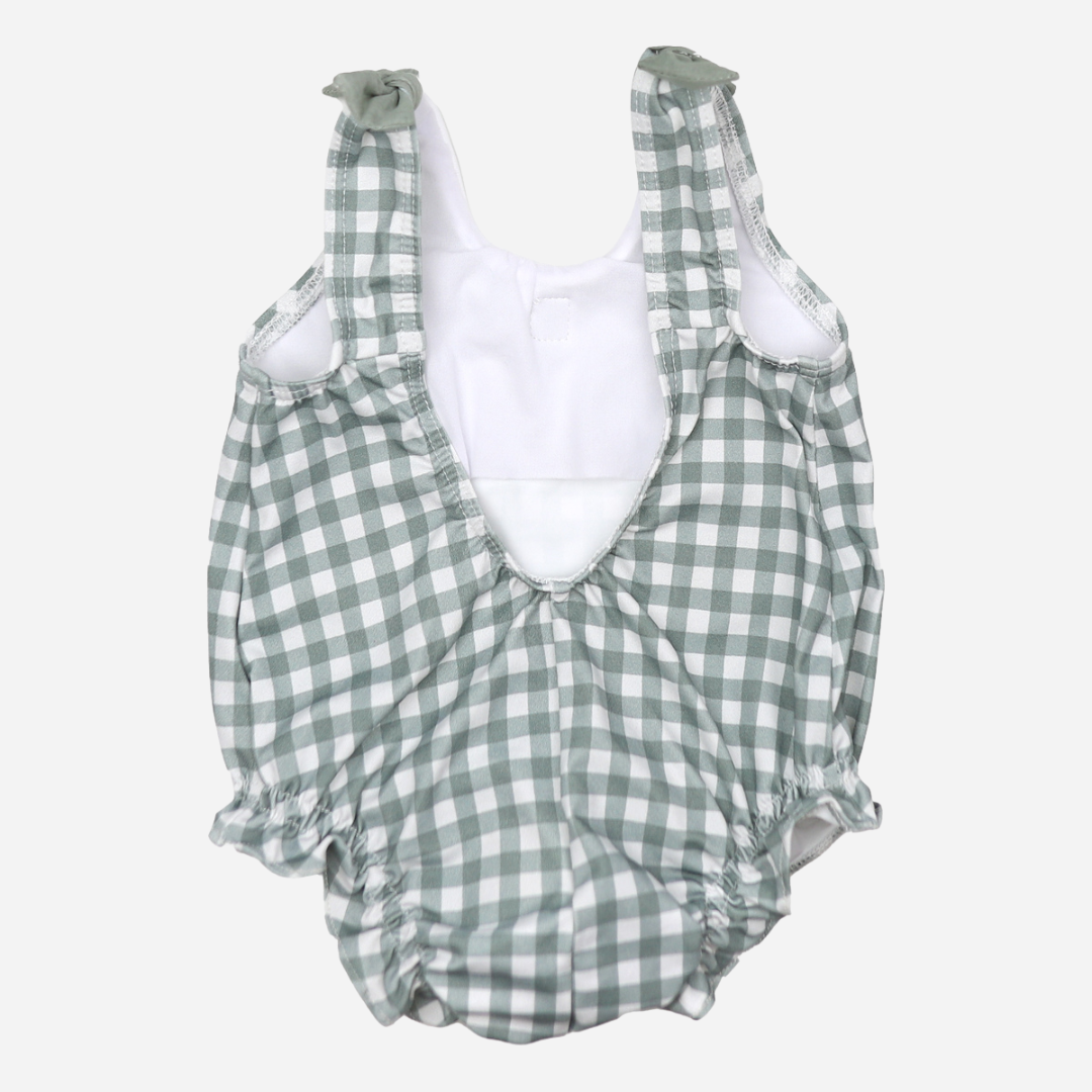 sold at Bombon shop, designed by Al Agua Patos Brand, this vichy print one-piece bathing suit for baby girls is perfect for summer. back view