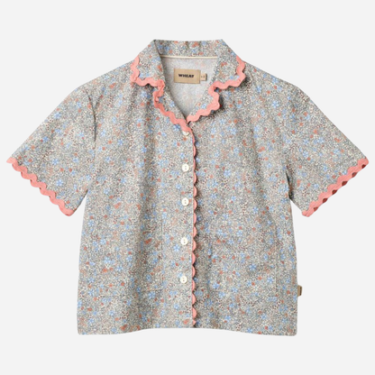 Sold at Bombon Shop, designed by Wheat, air blue flowers organic cotton short sleeve blouse with lace trim and soft blue floral print.
